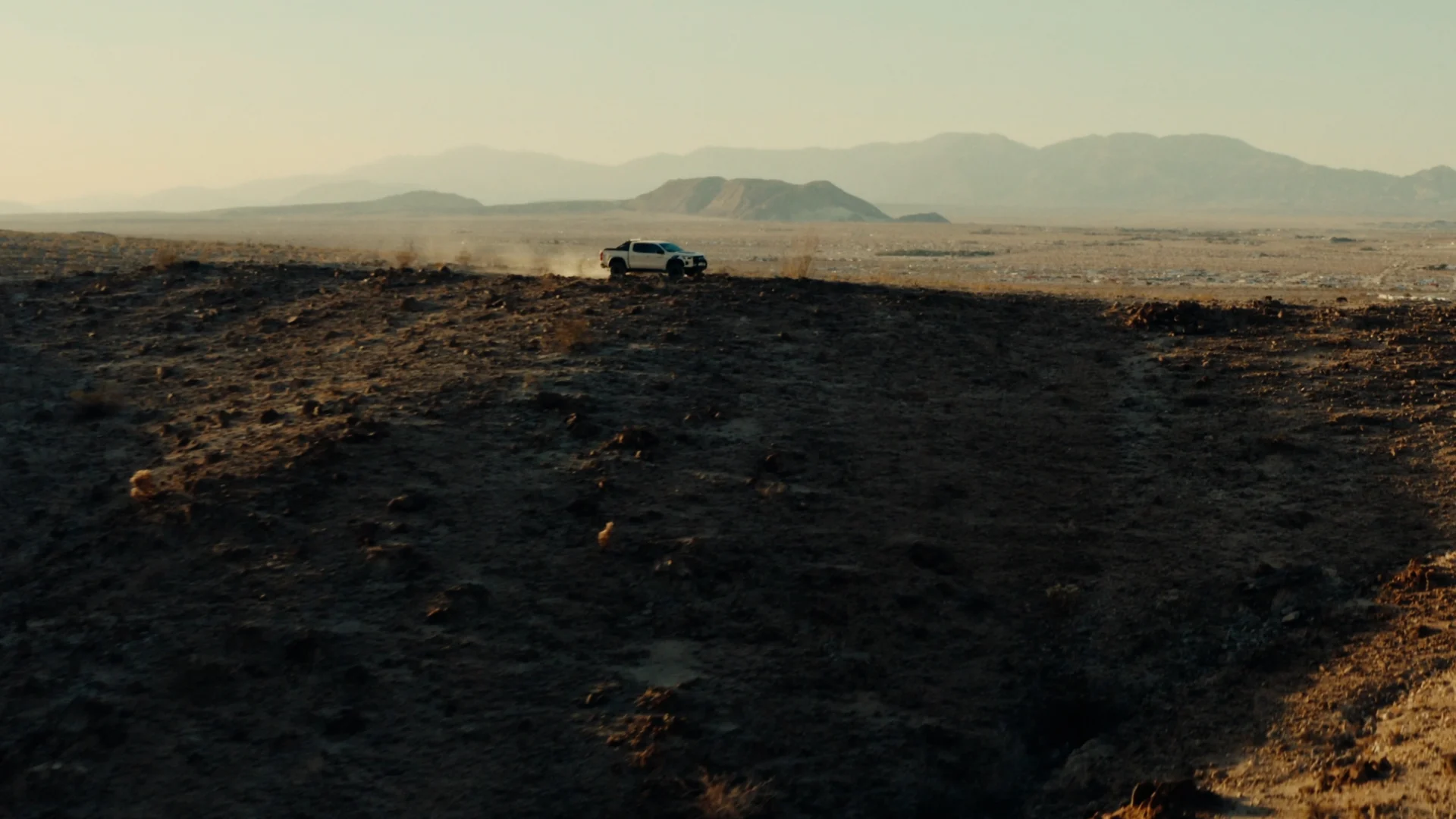Pickup crossing a desert
