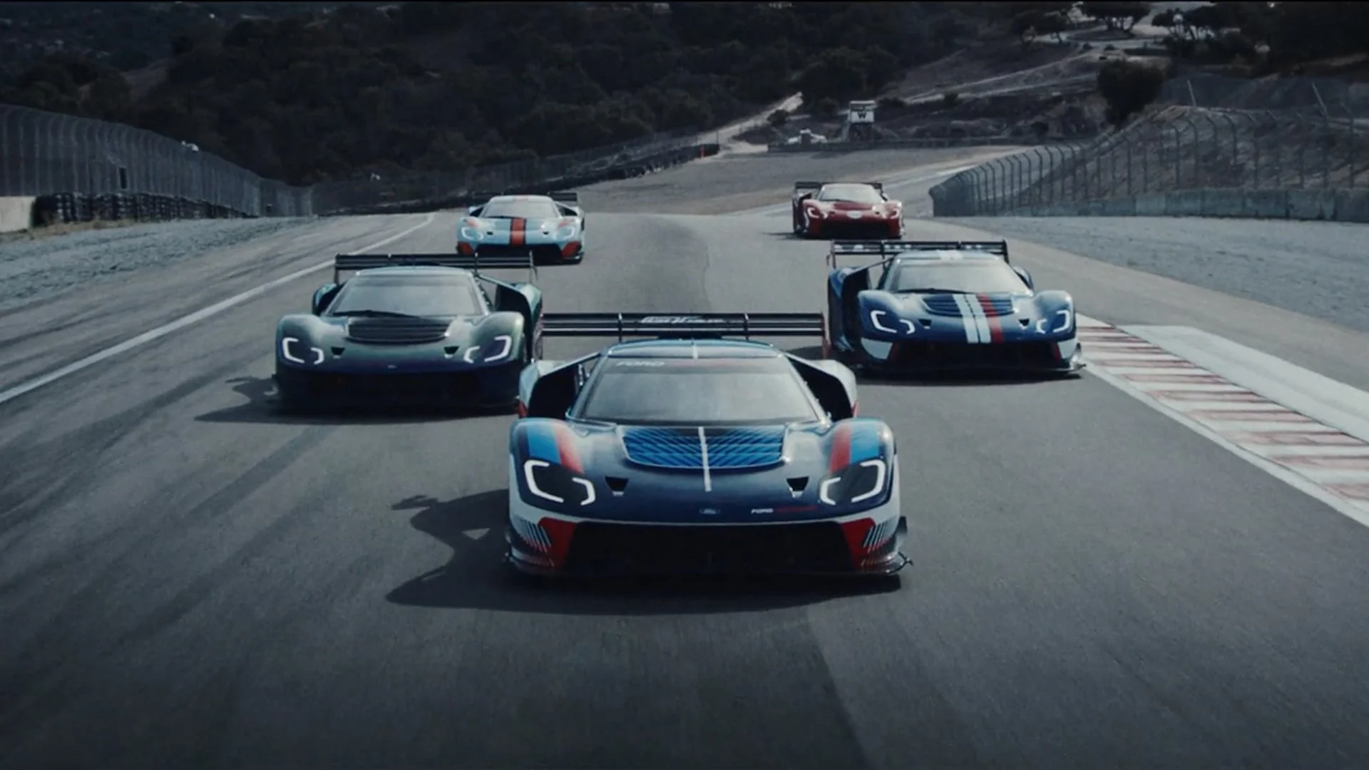 A pack of race cars on a track
