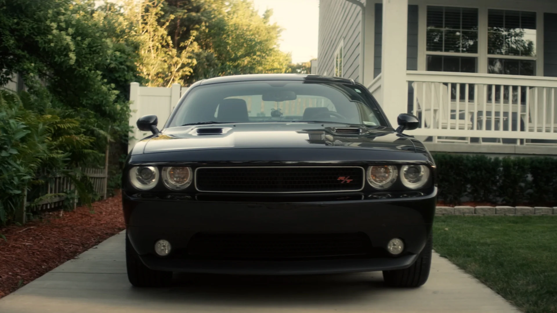 Muscle car in a suburban driveway