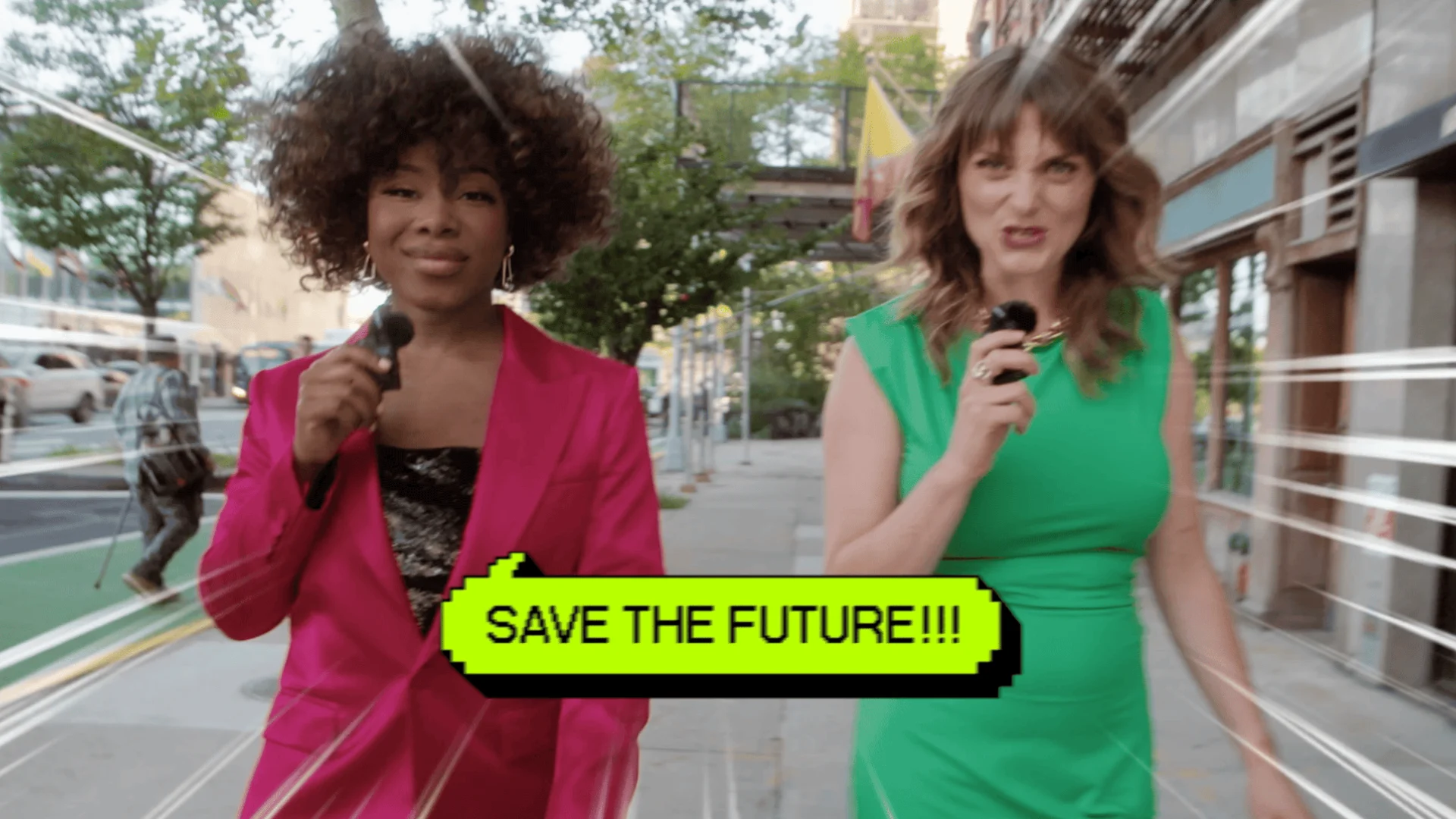 Two hosts with microphones on a city sidewalk