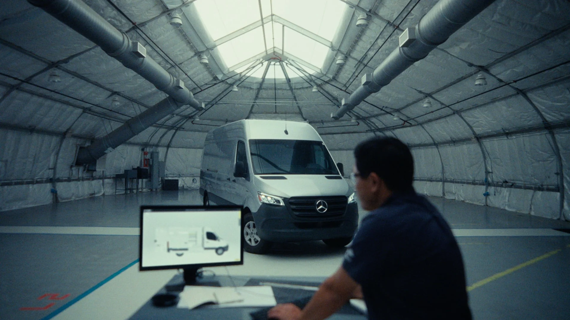 Electric van in a bright hangar